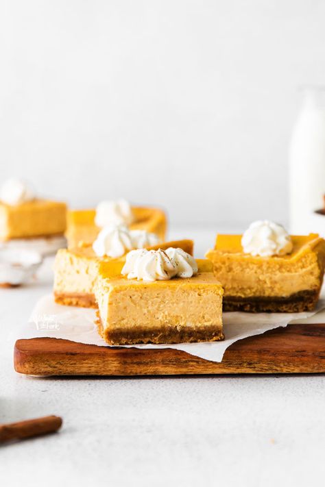 Simple and delicious Gluten Free Cheesecake Bars are easy to make and are a great pumpkin dessert for Thanksgiving! Cheesecake bars are quicker to make than a regular cheesecake. They’re portable and are a great option for make-ahead desserts to bring to a holiday dinner. Pumpkin cheesecake bars can also be made with regular graham crackers if you don’t need gluten free. Gluten free cheesecake recipe from @whatthforkblog - visit whattheforkfoodblog.com for more gluten free baking and desserts. Gluten Free Cheesecake Recipes, Gluten Free Pumpkin Cheesecake, Gluten Free Pumpkin Bars, Gluten Free Pumpkin Recipes, Thanksgiving Dinners, Gluten Free Graham Crackers, Cheesecake Layer, Pumpkin Cheesecake Bars, Pumpkin Cheesecake Recipes