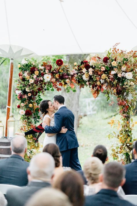 First Kiss Beneath a Chuppah Adorned with Fall Blooms and Leaves Moody Tablescape, Floral Arches, Wedding Chuppah, White Weddings Reception, Fall Wedding Ideas, Orchid Centerpieces, Floral Installations, Wedding Arches, Eclectic Wedding