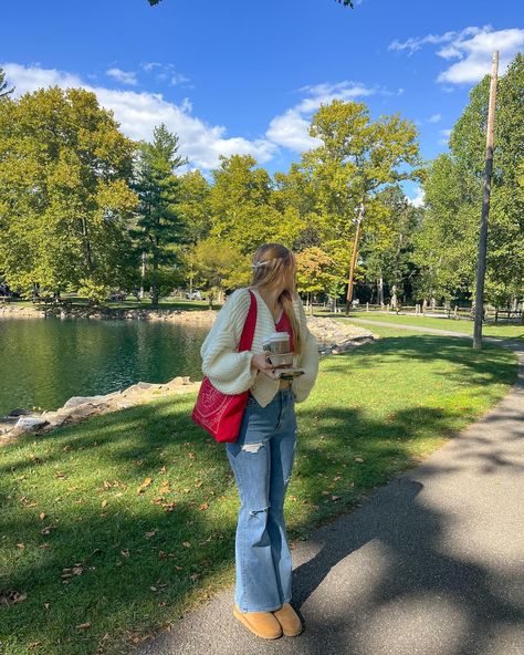 cardigan weather🫶🏻☕️🎃📕🍂 .. fall aesthetic, fall fashion, fall style inspo, fall outfits, fall inspiration, pinterest aesthetic, casual style, chunky cardigan, flare jeans, ugh minis, downtown girl style, starbucks fall menu Red Tote Bag Outfit, Downtown Girl Style, Tote Bag Outfit, Fall Menu, Autumn School Outfit, Red Tote Bag, Outfit Red, Fall Inspiration, Red Tote