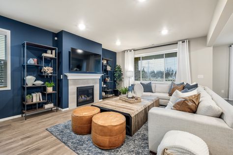 Blue And Gray Living Room Walls, Blue Living Room Aesthetics, Accent Blue Wall Living Room, Grey Blue Accent Wall Living Room, Blue Wall Family Room, Navy And Oatmeal Living Room, One Blue Wall Living Room, Blue Accent Walls Living Room, Open Concept Kitchen Living Room Blue Cabinets