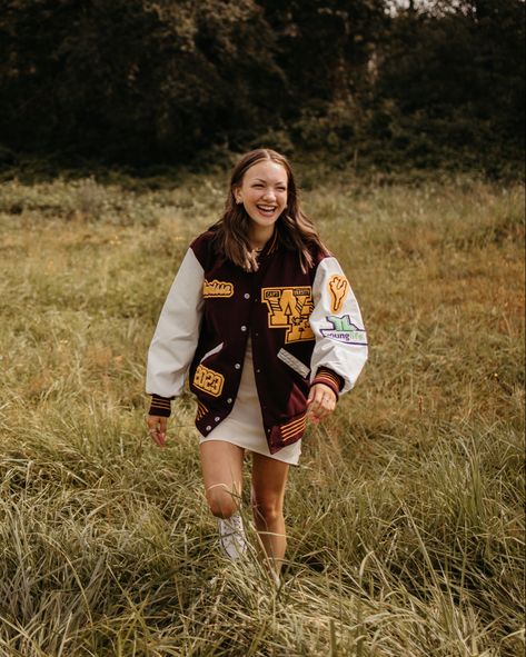 Letterman's Jacket Outfit, Senior Photos Letterman Jacket, Senior Picture Ideas With Letter Jacket, Senior Picture Ideas Letterman Jackets, Letterman Jacket Aesthetic, Senior Pictures Letterman Jacket, Letterman Jacket Senior Pictures, Letterman Outfit, Varsity Jacket Aesthetic