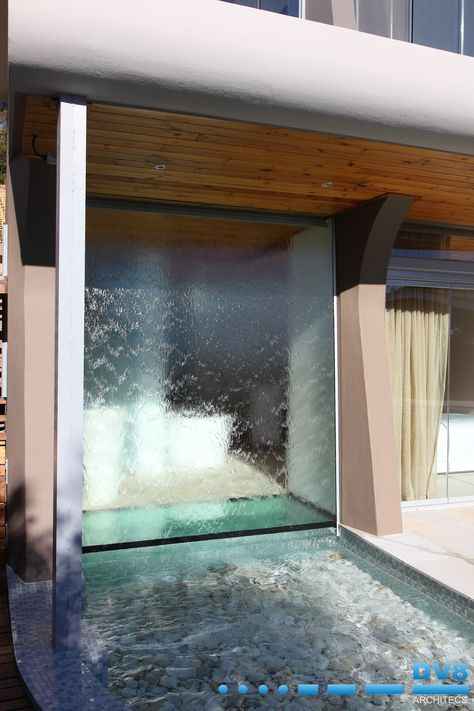 Waterfall wall created on the external glass. Waterfall runs into a pond and forms the window of the bathroom. Pond runs under the bathroom with a glass floor. Glass Water Wall, Waterfall Glass Wall, Window Waterfall, Glass Fountain Water Walls, Indoor Waterfall Wall Spa, Water Curtain Architecture, Unconventional Homes, Hotel Lobby Water Feature, Spa Waterfall