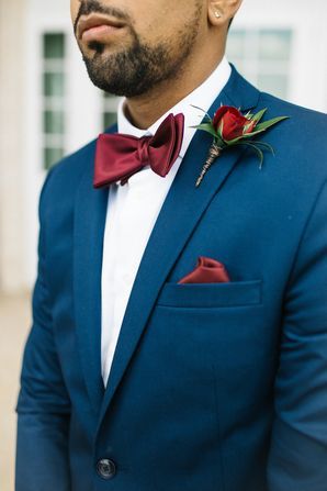 Navy Jacket with Burgundy Bow Tie and Pocket Square | The Knot #theknot #groomstyle #weddinginspiration #weddingcolorschemes #navy #burgundy Navy Suit Burgundy Bow Tie, Maroon Bow Tie, Navy And Burgundy Wedding, Burgundy Bow Tie, Navy Tuxedos, Pocket Square Styles, Pocket Square Pattern, Pocket Square Wedding, Suits Groom