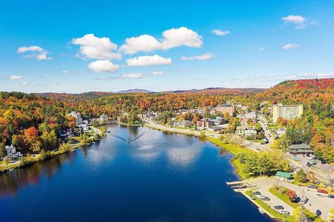 While the name "Adirondack" was originally a derisive epithet, meaning "eater of tree bark," today, it is anything but derisive. The region in New York state teems with numberless opportunities for adventures that would satisfy the highest hopes of a thrill-seeker. Extending over an area that measures more than 2.4 million hectares, the Adirondacks is home to spectacular gorges, pristine forests, and several sparkling lakes. Among the more than 2,300 lakes and ponds that dot this scenic lands... Vermont Trip, Saranac Lake Ny, Whiteface Mountain, Adirondack Park, Saranac Lake, Mountain City, The Adirondacks, Park In New York, Lake Champlain