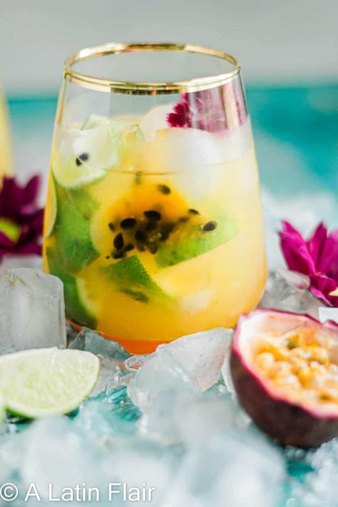 Brazilian Passion Fruit Caipirinha Cocktail. Fantastic easy cocktail of few ingredients (lime, cachaca, Passion Fruit, sugar). Refreshing. Tropical. Delicious. #cachaca #caipirinha #passionfruitcaipirinha #braziliancocktails #brazilianrecipes Passion Fruit Caipirinha Recipe, Passion Fruit Vodka Cocktail, Strawberry Fig Preserves, Easy Carne Asada, Passion Fruit Whiskey Cocktail, Passion Fruit Liquor Cocktails, Spicy Passion Fruit Cocktail, Caipirinha Recipe, Brazilian Cocktail