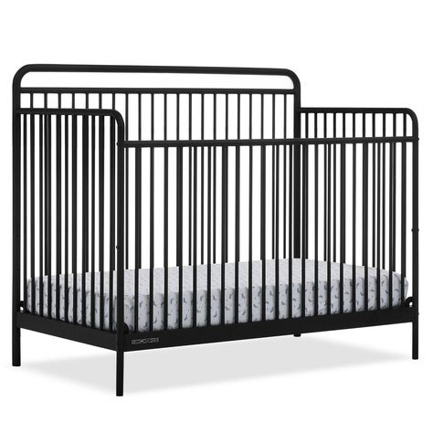 Design your dream nursery with the Hayden 5-in-1 Convertible Crib by Delta Children. The simple curves, round spindles and metal construction evoke the look of a cherished family heirloom. Extremely versatile, this crib grows with your child for many years. It features three mattress heights, and converts into a toddler bed, daybed, sofa and full size bed with headboard (Daybed/Sofa Rail included; Toddler Guardrail # W106725 and standard metal bed frame sold separately). Available in Matte Black, Tea Green and Warm Gray. Crib mattress sold separately. Delta Children was founded around the idea of making safe, high-quality cribs affordable for all families. That's why all Delta Children cribs are JPMA certified, and are tested above and beyond industry standards. Black Crib Nursery, Bed With Headboard Only, Black Crib, Metal Crib, Black White Nursery, Rocking Bassinet, Crib Nursery, Dream Nursery, Simple Nursery