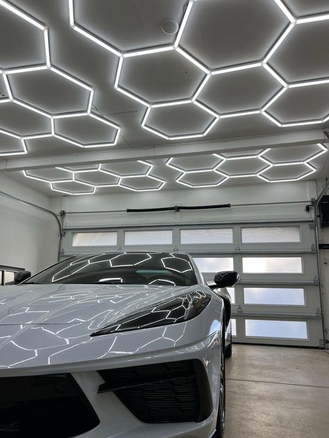 Transform your garage into a modern masterpiece with our Hexagon LED Lighting system! 🌐 Shop now at hexaspacedecor.com 📩 info@hexaspacedecor.com #Garage #garagegoals #hexagonlights #ModernSpaces #luxurygarage #LEDLighting #SpaceTransformation #HexagonLighting #showroom #HomeImprovement #HexaSpaceDecor Hexagon Lighting, Garage Floor Tiles, Garage Flooring, Luxury Garage, Flooring Tiles, Garage Plan, Garage Cabinets, Garage Floor, Space Decor