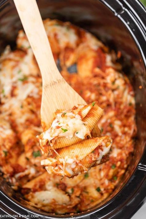 Make dinner simple when you make Crockpot stuffed shells recipe. The shells are stuffed with a delicious cheesy filling and the slow cooker does all the work. This easy stuffed shells recipe is the best homemade Italian meal. Try making this classic cheese stuffed recipe with ricotta. #eatingonadime #crockpotstuffedshells #stuffedshellsrecipeeasy #ComfortFoods #RicottaEasy #EasyCheese #stuffedshellsrecipericotta #jumbo #large #dinners Crockpot Stuffed Shells, Chicken Alfredo Lasagna Recipe, Italian Crockpot Recipes, Eating On A Dime Recipes, Jumbo Shells, Family Friendly Dinner Recipes, Air Fryer Recipes Keto, Crockpot Pasta, Christmas Sleepover