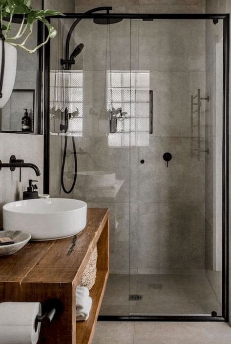 a modern industrial bathroom done with concrete, with a glass enclosed shower space, a wooden vanity, a round sink and black fixtures Drømme Bad, Makeover Kamar Mandi, Tile Interior, Industrial Style Bathroom, Bathroom Farmhouse, Farmhouse Tile, Industrial Bathroom, Luxury Kitchens, Bathroom Renos