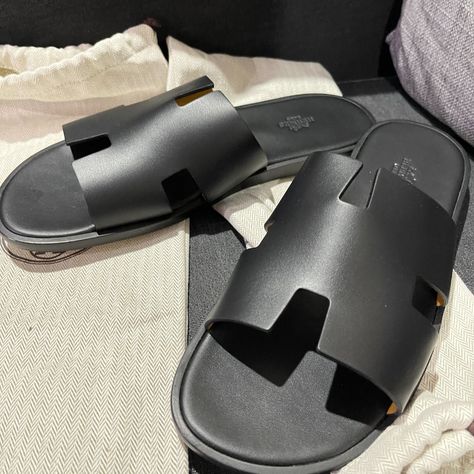 Brand New Herms Men's Izmir Sandals In Coveted And Hard To Get Noir Calfskin Leather With Soft Suede Bottom H Logo New With Box And Dustbags Iconic Sandals Instantly Recognizable And Never Worn, Purchased Recently But Moving And Don't Need Anymore. Description: Sandal In Calfskin With Iconic "H" Cut-Out And Raw-Edged Detail An Iconic Hermes Style, This Silhouette Is An Essential Piece In Every Wardrobe. Made In Italy Open To Offers And Negotiations Within Reason 100% Authentic. Limited Edition - Man Sandals, Hermes Sandals Men, Luxury Summer Sandals For Men, Slides For Men, Luxury Sandals For Men, Men’s Sandals, Men Sandals, Hermes Slippers For Men, Hermes Sandals