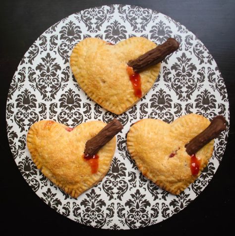 DIY Buffy the Vampire Staked Valentine’s Strawberry Heart Pies... Vampire Desserts Treats, Vampire Strawberries, Vampire Dessert Ideas, Buffy The Vampire Slayer Birthday Party, Vampire Food Ideas, Vampire Party Food, Goth Bakery, Heart Hand Pies, Vampire Valentine