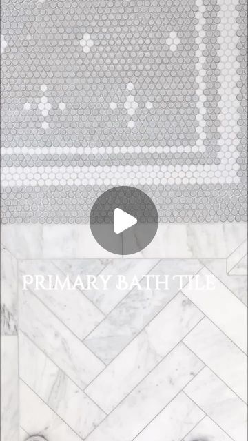 Tricia Crist on Instagram: "Primary Bathroom Tile~  I knew when we started designing our primary bathroom that I wanted herringbone marble floor!  Then I found out how expensive marble can be! I searched and searched, and found the perfect marble for me that was also affordable, as far as marble goes!  I did not want marble in the shower because we were doing a steam shower and I worried too much about cleaning dirt/mold off of the marble.   I found a classic white subway tile for the walls that had a raised design on it to add a little detail!  The floor of the shower was much more difficult for me because I wanted to keep the bathroom very classic and only add color with decor!  But having a bathroom with white walls, basically a white floor, and white shower walls, I knew I needed some Carrera Marble Bathroom Master Baths White Subway Tiles, White Subway Tile Shower With Accent Carrara Marble, Tile Herringbone Floor, Bathroom Tile Herringbone, Carrara Marble Herringbone Bathroom Floor, Marble Shower Gray Floor, White Marble Shower Dark Floor, Subway Tile Herringbone, White Traditional Bathrooms