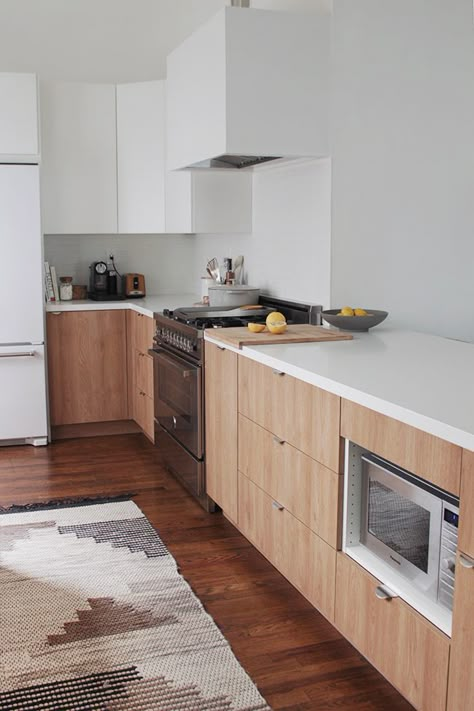 minimal kitchen, wooden lower cabinets, white uppers, neutral patterned rug Stenstorp Kitchen Island, Ikea Kitchen Lighting, Ikea Kitchen Island, Ikea Kitchen Design, Condo Remodel, Minimal Kitchen, London Kitchen, 아파트 인테리어, Ikea Kitchen