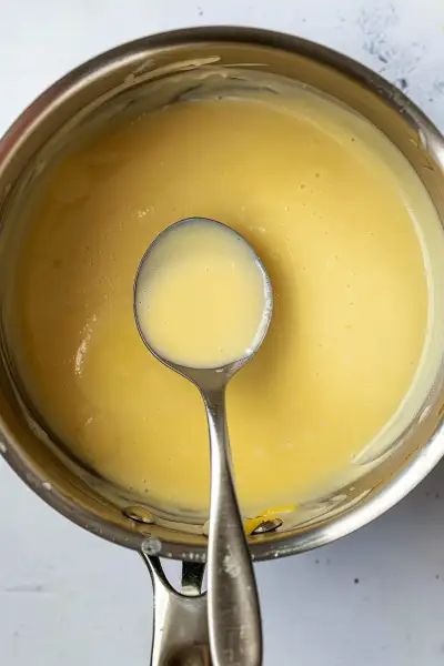 Discover the joy of making Creamy Lemon Butter Sauce with this simple recipe. It combines wine, cream, and lemon for a luscious and zesty sauce. Ideal for pairing with grilled chicken, fish, pasta, and vegetables. Try it now and transform your meals! Lemon Cream Sauce For Fish, Lemon Sauce For Pasta, Lemon Butter Sauce For Fish, Creamy Sauce For Fish, Creamy Lemon Butter Sauce, Pasta And Vegetables, Sauce For Fish, Butter Cream Sauce, Lemon Cream Sauce