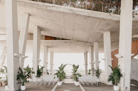 Modern Wedding in a Parking Garage Embroidered Green Ceremony Set, Modern Tropical Wedding Ceremony Decor, Indoor Tropical Wedding Ceremony, Parking Garage Wedding, Tropical Wedding Ceremony Arches, Tropical Ceremony, Garage Wedding, Palm Event Center Wedding, Industrial Wedding Inspiration