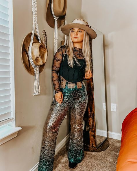 The perfect @laineywilson concert idea! ⚡️    Shop the hat in @thekierstenzile_collection     Full outfit is linked on LTK 🤠        #laineywilson #laineywilsonhat #burendhat #distressedhat #stylingvideo #cowgirlstyle #cowgirlfashion #dingoboots #cowboyboots #bellbottoms #outlawnation #outfitinspos #discoverunder10kfashion #leatherfeather #leatherfashionista #featherhat  #houstonrodeo      Lainey Wilson style // Lainey Wilson hat // burned hat // custom hat // styling video // rodeo fashion /... Lainey Wilson Style, Lainey Wilson Outfits, Hat Styling, Dingo Boots, Nashville Outfit, Houston Rodeo, Lainey Wilson, Nashville Outfits, Western Outfit