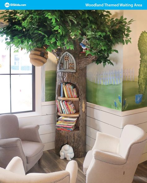 This photo shows how to use themed environments within waiting areas. This waiting area has themed décor showing woodland theming and involves a large scale, realistic style tree foam sculpture and fun adorable woodland forest animals to match. This theming can used for pediatric spaces for kids and kids play areas within churches, malls, schools, and other child-friendly businesses. Pediatric Waiting Room Ideas, Interactive Activities For Kids, Swiftie Bedroom, Tree Classroom, Kids Jungle Room, Kids Salon, Forest Room, Tree Bookshelf, Forest Mural