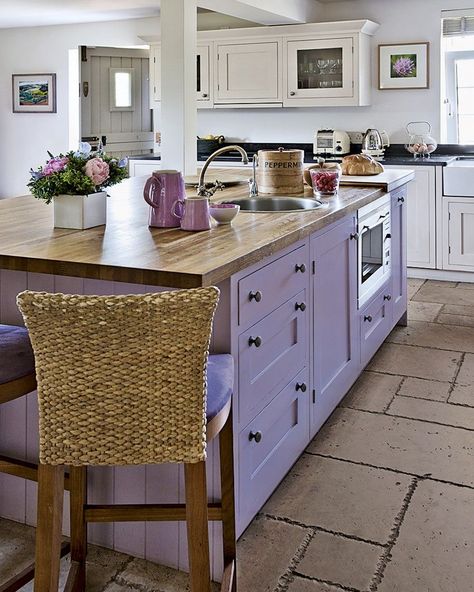 We are completely in love with this unique Lilac Kitchen 💜 The use of lilac paint on the island has such a striking effect! Accents of purple, pink and green across the kitchen perfectly compliment the colour scheme!🌸•Swipe across to see the products we have chosen to recreate this stunning interior🤩✨•Image Credit: Polly Eltes | #LoveFandP•#country #countryside #cottage #cottagestyle #countryfeatures #paint #countrychic #countryhome #countryinterior #countrydecor #interiordetails #interiorsty Colored Lower Cabinets, Purple Kitchen Cabinets, Violet Kitchen, Purple Kitchen Decor, Purple Cabinets, Lavender Kitchen, Rainbow Kitchen, Purple Kitchen, Purple Home