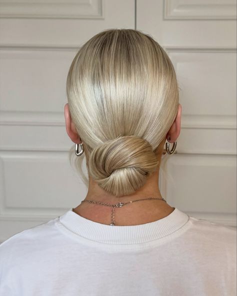 From trial to wedding day. A beautiful sleek and minimalistic modern low bun. #weddinghair #belfasthair #bridalhair #clandeboyewedding #lowbun #sleekhair #modernbride #sleekbun #northernirelandwedding #weddinghairstylist #belfastbride #belfastweddinghair #hairtrends #summerhair #weddinghairideas #weddinghairstyles #upstyle Low Bun Wedding Hair Bridesmaid, Smooth Low Bun, Sleek Bride Hair, Low Bun Wedding Hair Blonde, Wedding Hair Sleek Bun, Sleek Bun Hairstyles Wedding, Slicked Back Bun Wedding Hair, Slick Back Bun Wedding Hair, Sleek Bridal Bun