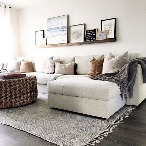 neutral tone living room // beige sofa sectional // gray hardwood floors // woven coffee table // floating shelf // shelf gallery wall Room Decorations Ideas, Koti Diy, Living Room Decorations, Trendy Living Rooms, Bohol, Living Room Decor Modern, Room Decorations, Living Room Inspo, Home Design Decor