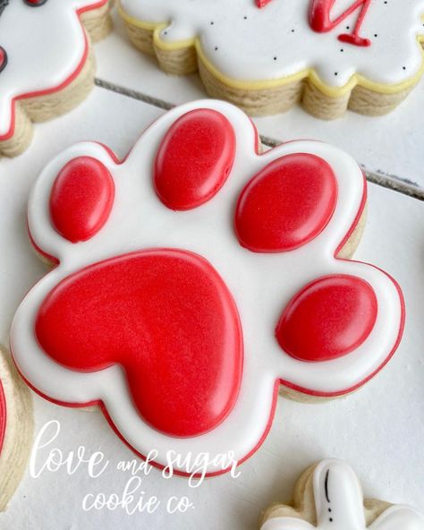 Katlin Julo on Instagram: “Puffy little paw print🐾 • • #pawprints #puppy #puppycookies #cliffordthebigreddog #royalicing #decoratedcookies #decoratedsugarcookies…” Dog Paw Cookies Decorated, Paw Cookies Decorated, Paw Print Cookies Decorated, Firefighter Birthday Cakes, Paw Cookies, Lake Birthday, Dog Bakery, Dog Cookies, Cookie Stencils