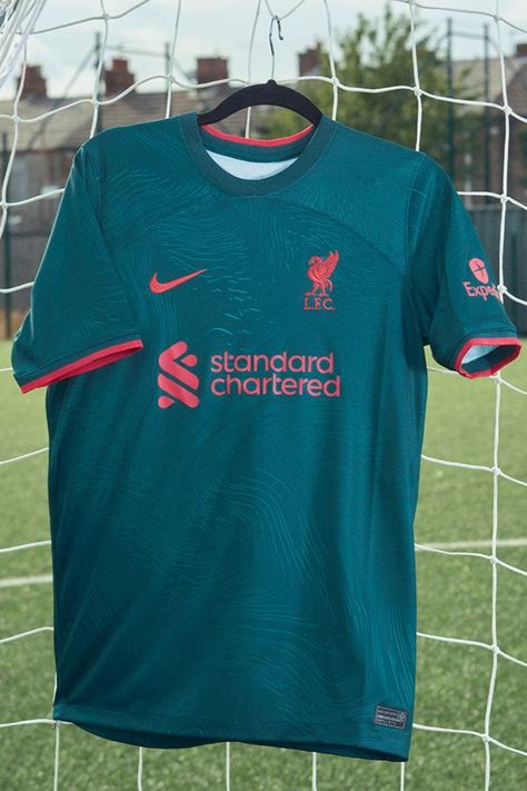 This season’s Liverpool third jersey comes inspired by the Liverbird, but this time in a much more literal sense than we’ve seen in seasons past. The Liverbird is really a Cormorant, a native English bird known for its short wings and diving ability – historically and symbolically, the cormorant is known as a tough and hardy creature that battles the odds of its environment. Liverpool Jersey, Liverpool Kit, English Club, Native English, Soccer Shop, Walk Alone, Liverpool Fc, Football Jerseys, Liverpool