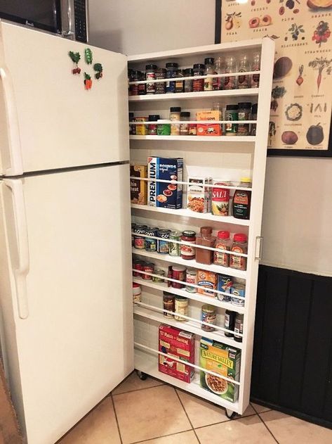 Get ready for a GAME changer! This is literally changing my life! Haha ok maybe not so dramatic, but this hide-away pantry is an amazing storage alternative that will open up some cabinet space!!! This kitchen storage is made by creating a slim sliding shelving unit for the space between your wall and refrigerator. It's amazing what a little wood and paint will do! Small Home Improvements, Food Storage Cabinet, Storage Hacks Diy, Diy Rangement, Canned Food Storage, Kitchen Storage Space, Woodworking Storage, Kitchen Organization Diy, Refrigerator Storage