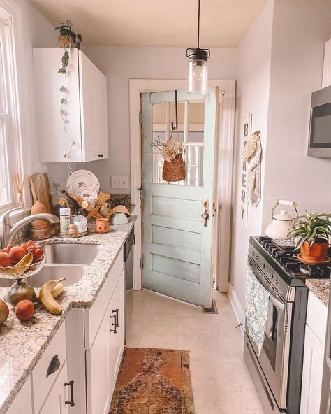 Narrow galley kitchens are no less capable of showcasing a stunning look. These small areas tend to have a naturally busy appearance, so keep the walls and flooring simple to eliminate the chance of overdecorating. A simple pendant or pot lights are ideal lighting styles for these compact kitchens. Small Galley Kitchen Ideas Narrow, Galley Kitchen Ideas Narrow, Neutral Cabinets, Beige Floor Tile, Floor Tile Ideas, Neutral Floor, Compact Kitchens, Small Galley Kitchen, Lighting Styles