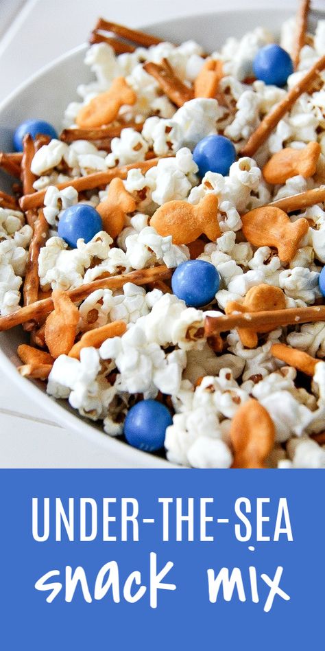 This under-the-sea themed snack mix is perfect for parties and movie nights. Under The Sea Party Snack Ideas, Water Theme Food Ideas, Nemo Snack Ideas, Under The Sea Snacks For Party, Nautical Snacks Food Ideas, Beach Treats Ideas, Ocean Themed Recipes, Snacks For Under The Sea Party, Ocean Birthday Snacks