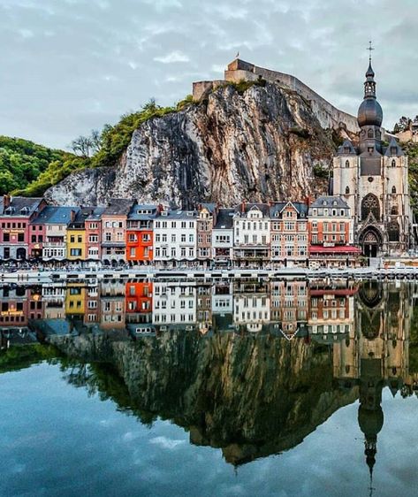 Dinant, Belgium teamtullytravel - If you're a fan of natural elements, then you'll definitely enjoy Dinant, Belgium. The city is all about water and stone, as it is set on the Meuse river and overlooked by its famous citadel standing on top of a high cliff. The city isn't very big, nor is it very modern, but its setting in the Meuse valley confers the city with a huge advantage for people looking for a change of scenery. Dinant Belgium, Belgium Travel, Chateau France, Travel Insurance, Amazing Destinations, Land Scape, Beautiful World, Travel Dreams, The Sky