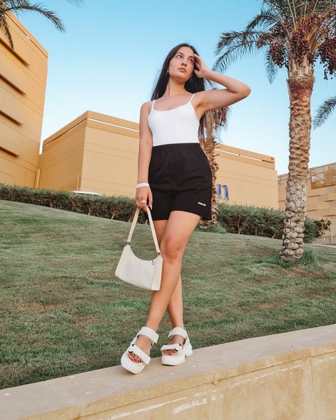 summer outfit inspo | fashion | aesthetic | street style | egypt | black shorts | white bodysuit | white mini bag | platform sandals White Platform Sandals Outfit, White Mini Bag, Platform Sandals Outfit, Aesthetic Street, White Platform Sandals, Bodysuit White, Sandals Outfit, White Platform, White Bodysuit