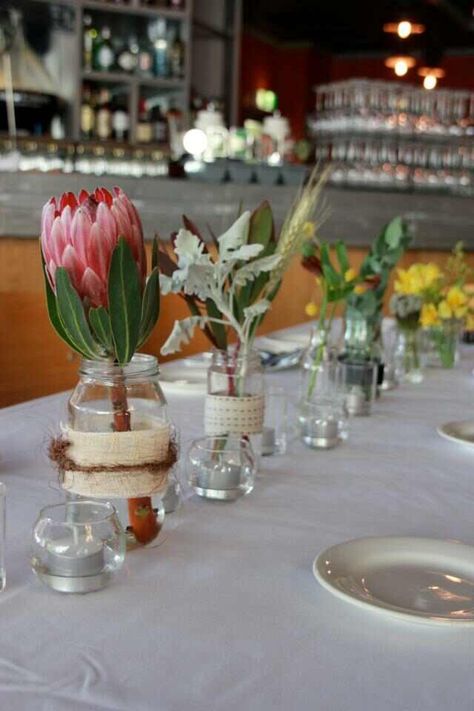 Native flowers - table settings.  Photo from The Wild Peony Native Flower Table Arrangements, Australian Native Wedding Table Flower Arrangements, Wedding Flowes, Christmas Setup, Flower Centrepieces, Long Table Wedding, Long Lunch, Table Flower Arrangements, Table Arrangements Wedding