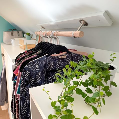 Sloped Walk In Closet, Slanted Ceiling Loft Ideas, Loft Storage Ideas Organizing Slanted Ceiling, Attic Clothes Hanging, Storage Ideas Attic, Storage Under Eaves Sloped Ceiling, Bedrooms With No Closet Ideas, Diy Closet Slanted Ceiling, Farmhouse Bedroom With Slanted Ceiling