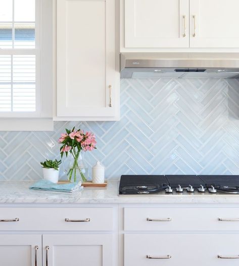 Kitchen with white cabinets and light blue backsplash. Light Blue Backsplash, Blue Herringbone Tile, Blue Backsplash Kitchen, Herringbone Tile Backsplash, Light Blue Kitchens, Kitchen Grey, White Kitchen Backsplash, Blue Backsplash, Kitchen Backsplash Designs