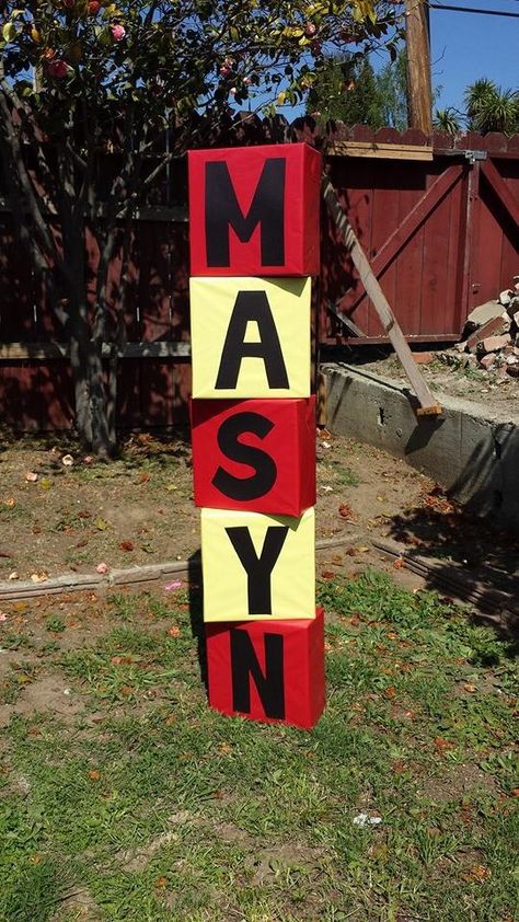 Blocks, made with cardboard boxes covered in wrapping paper.  Cut out large letters for  name or words. Could turn into giant dice too! Giant Dice, Carnival Baby Showers, Mr Onederful Birthday, Baby Blocks Baby Shower, Graduation Party Backdrops, Birthday Craft, Super Mario Bros Birthday Party, Glow In Dark Party, Abc Blocks