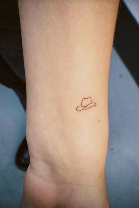 Small Rodeo Tattoos, Dragon Eating Tail Tattoo, Cowboy Hat Tattoo Ideas, Little Cowboy Hat Tattoo, Fine Line Cowboy Hat Tattoo, Mini Cowboy Hat Tattoo, Simple Cowboy Hat Tattoo, Tiny Cowboy Hat Tattoo, Cowboy Hat Nails