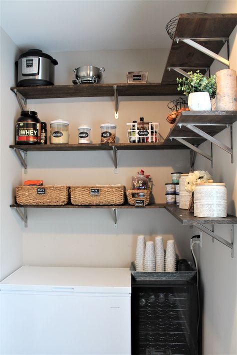 Pantry organization includes baskets for protein bars, snacks, and sauces, along with clear containers for protein powder and nuts. Gym Designs, Clear Containers, Farmhouse Pantry, Clear Container, Gym Design, Pantry Organization, Protein Bars, Protein Powder, Kitchen Storage