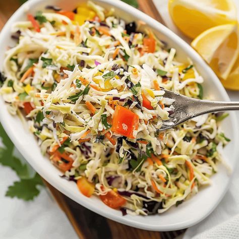 If you’re looking for a vibrant and refreshing side dish that’s perfect for any occasion, this Mediterranean Coleslaw is just what you need. With a zesty Lemon Garlic Vinaigrette and ... Read more Banana Pepper Rings, Coleslaw Mix, Stuffed Banana Peppers, Red Bell Pepper, Breakfast Lunch Dinner, Red Pepper Flakes, Salad Ingredients, Coleslaw, Home Recipes