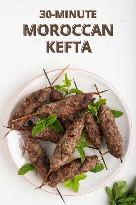 This Grilled Moroccan Kefta, also sometimes called Brochettes, is made in just 30 minutes with a blend of ground beef or lamb, onion, paprika, cumin, and fresh herbs. Known globally for its bold flavor, juicy texture, and easy-to-eat skewered appearance, this recipe makes a wonderful appetizer or entree served with bread, salad, and rice. Kefta Recipe, Moroccan Kefta, Chicken Tagine, American Summer, Bread Salad, Ground Lamb, Puerto Rican Recipes, Moroccan Food, International Food