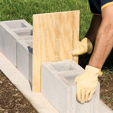 Working with Concrete Block Outdoor Upgrades, Concrete Block Retaining Wall, How To Lay Concrete, Concrete Block Foundation, Diy Retaining Wall, Building A Retaining Wall, Concrete Block Walls, Alternative Housing, Cinder Block Walls