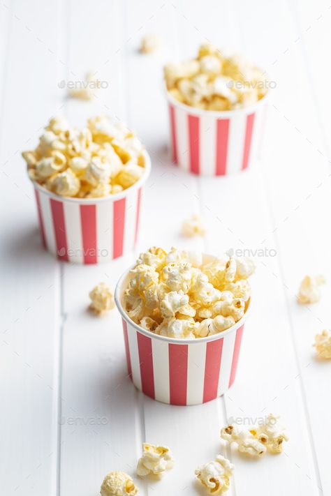 Sweet tasty popcorn in striped paper cup. by jirkaejc. Sweet tasty popcorn in striped paper cup on white table. #Sponsored #popcorn, #striped, #Sweet, #tasty Popcorn Cups Party, Packaging Graphics, Popcorn Cups, Chili Cookoff, White Popcorn, Curious George Birthday, Popcorn Snacks, Colorful Birthday Party, Simple Birthday Decorations