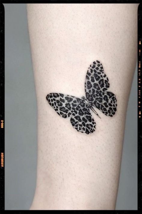 Leopard Butterfly Leg Tattoo Leopard Print Tattoo For Women Arm, Animal Print Butterfly Tattoo, Leopard Feather Tattoo, Leopard Outline Tattoo, Leg Filler Tattoo Ideas Women, Butterfly Leopard Tattoo, Leopard Print Hand Tattoo, Cheetah Print Butterfly Tattoo, Leopard Print Butterfly Tattoo