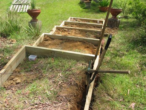 Our back garden is on a very steep slope.  Part of it has a hill that for every 4.5 metres, the level drops a metre in height.  I consulted a landscape gardener and he quoted me about $5,500 to put steps in - he estimated about 20 steps.  Well, that was much more than we could afford.  So we turned to our neighbour who is a carpenter/builder.  He built his own home so I figured he could do just about anything!  He took a look and told me he could do it for about $1,500 - $2,000 but tha… Garden With Bamboo, Steps On A Slope, Steep Gardens, Landscape Stairs, Small Water Features, Garden Stairs, Back Steps, Outdoor Steps, French Country Garden