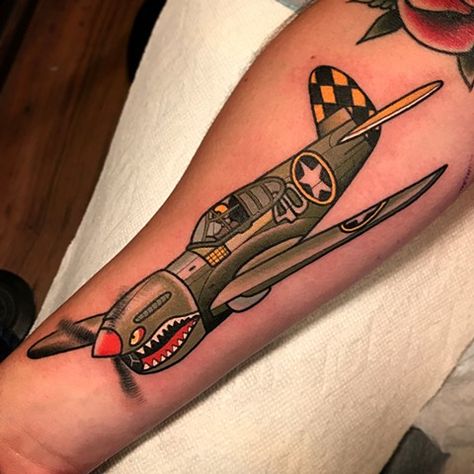 fighter plane tattoo by dave wah at stay humble tattoo company in baltimore maryland the best tattoo shop and artist in baltimore maryland Traditional Fighter Plane Tattoo, Old School Plane Tattoo, Spitfire Plane Tattoo, Air Force Traditional Tattoo, Warplane Tattoo, American Traditional Plane Tattoo, Traditional Plane Tattoo, Fighter Plane Tattoo, Aviation Tattoo Pilots