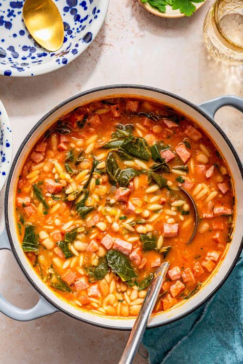 A hearty mix of beans, sausage, pasta, and greens make this flavorful swamp soup a complete dinner. I make this Southern recipe on repeat in the winter. Swamp Soup Recipe, Soup Stovetop, Keri Soup, Good Soup, Southern Recipe, Nourishing Meals, Soups Stews Chilis, The Long Dark, 2024 Recipes