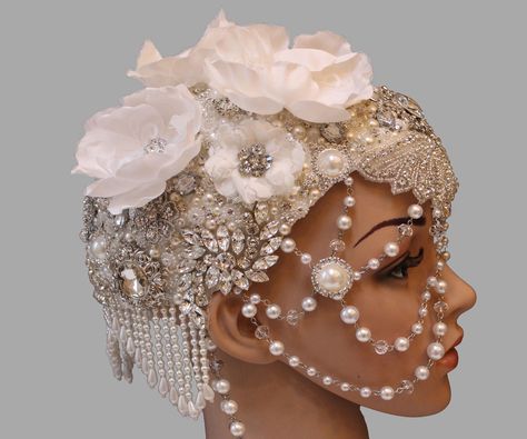 In this instructable, I will show you how to make this 1920's inspired jeweled headpiece. Although probably not an everyday kind of accessory, it would be rather regal and stunning for the right occasion. As an added bonus, the foil and duck tape base will prevent extraterrestrial life from reading your mind in case of an invasion, while still staying fashionable. I wish the pictures could truly capture just how sparkly it is. I have included a few variations to show the versatility of th... Diy Head Piece How To Make, Head Dress Diy, Jeweled Headpiece, Diy Headdress, Ostrich Head, Diy Foil, Extraterrestrial Life, Costume Jewelry Crafts, 1920s Headpiece