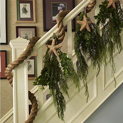 A simple way to make Christmas decorating beachy. Don't forget the rope, it really makes this look complete. Seaside Christmas, Christmas Hallway, Christmas Stairs Decorations, Christmas Stairs, Deco Marine, Diy Beach Decor, Chic Christmas Decor, Coastal Christmas Decor, Coastal Holiday