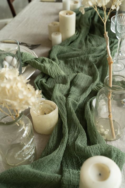 Product Description: The Rustic Greenery Table Runner for Boho Weddings and Home Decor is a perfect addition to your rustic-themed events and home styling. Handmade with love and care, this table runner adds a touch of natural beauty and elegance to any occasion. Made from high-quality cotton, pure cotton gauze, and cheesecloth, this runner features a rustic style that adds a charming and boho vibe to your space. With its natural cotton material and earthy colors, it effortlessly complements a w Greenery Table Runner, Woodland Wedding Centerpieces, Bachelorette Party Decor, Green Table Runner, Burnt Orange Weddings, Earthy Wedding, Tafel Decor, Modern Wedding Decor, Table Runners Wedding