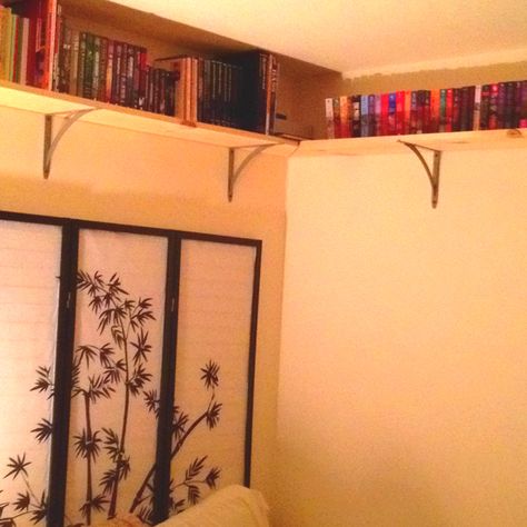 Ceiling shelves to store our books and misc stuff! Hide Electrical Cords, First Home Essentials, High Room, Corner Shelving Unit, Shelf Inspiration, Ceiling Shelves, Garage Room, Interior Design Process, Library Shelves