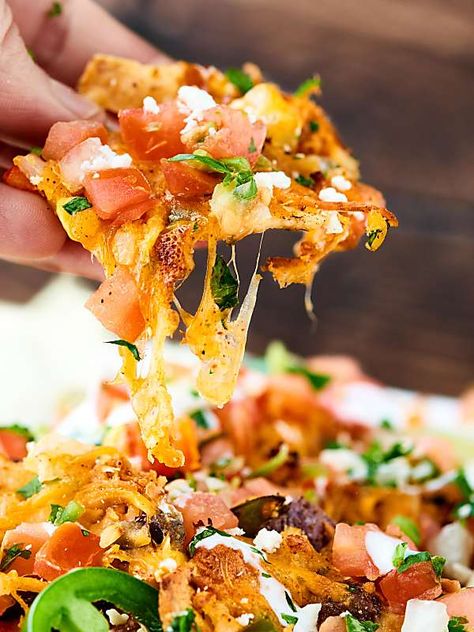 These Loaded Chicken Nachos have 12 layers! and are full of tender veggies, flavorful chicken, beans, corn, and TONS of cheese. Surprisingly quick, easy and delicious! showmetheyummy.com Crockpot Chicken Nachos Recipe, Loaded Chicken Nachos Recipe, Loaded Chicken Nachos, Shrimp Nachos, Steak Nachos, Chicken Beans, Steak Shrimp, Loaded Chicken, Chicken Nachos Recipe